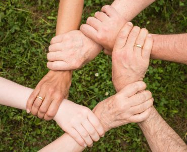 pexels-pixabay-461049 Hands holding each other.